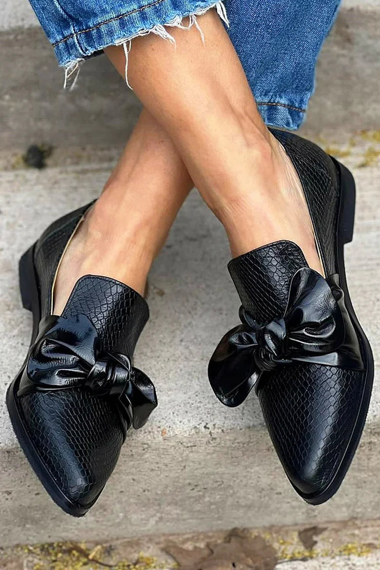 Elegant Black Loafer with a Gleaming Bow