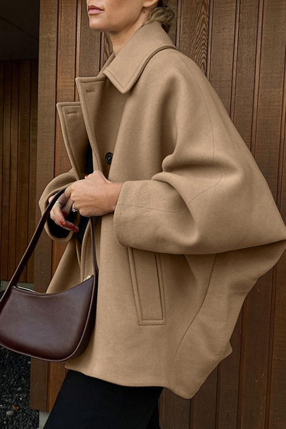 Oversized wool coat with bat wing sleeves