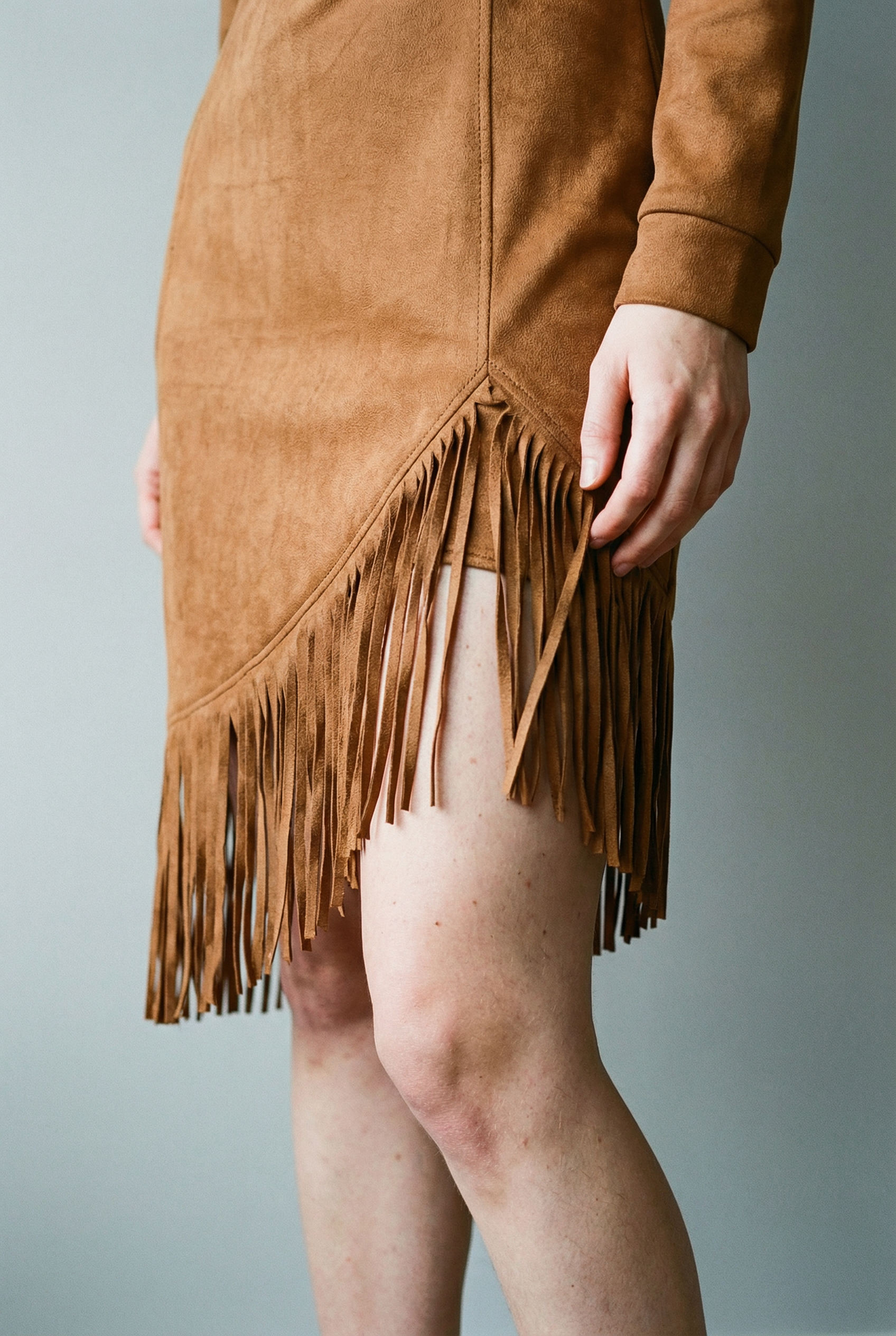 Suede midi dress with long sleeves and irregular fringes