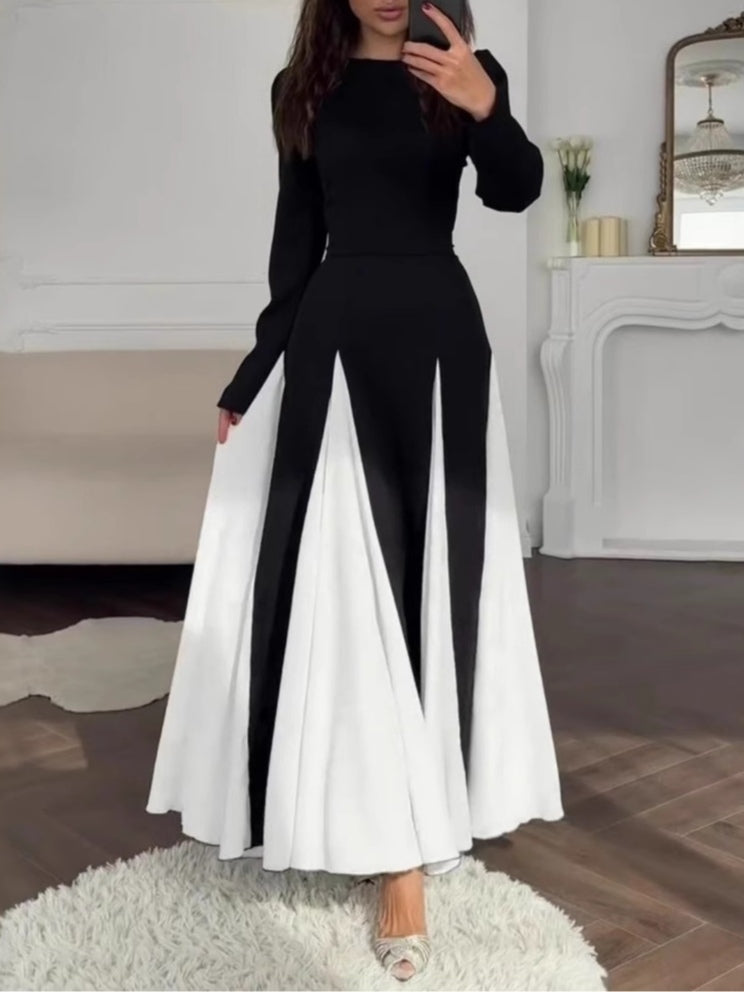 Elegant long-sleeve dress with a round neck and colorblock design in black and white