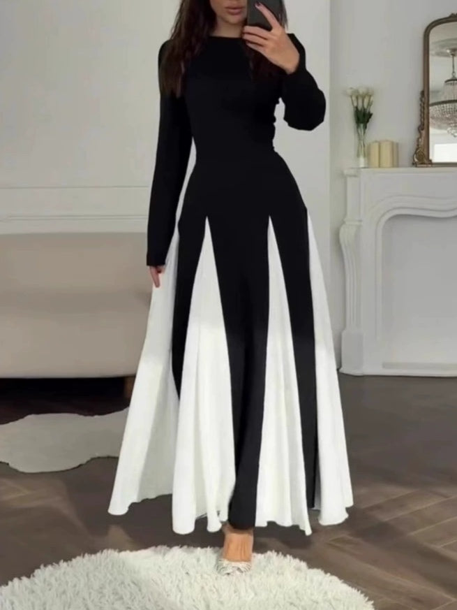 Elegant long-sleeve dress with a round neck and colorblock design in black and white
