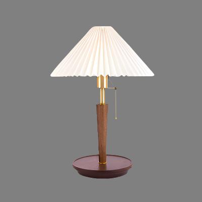 Elegant vintage table lamp made of noble pleated wood