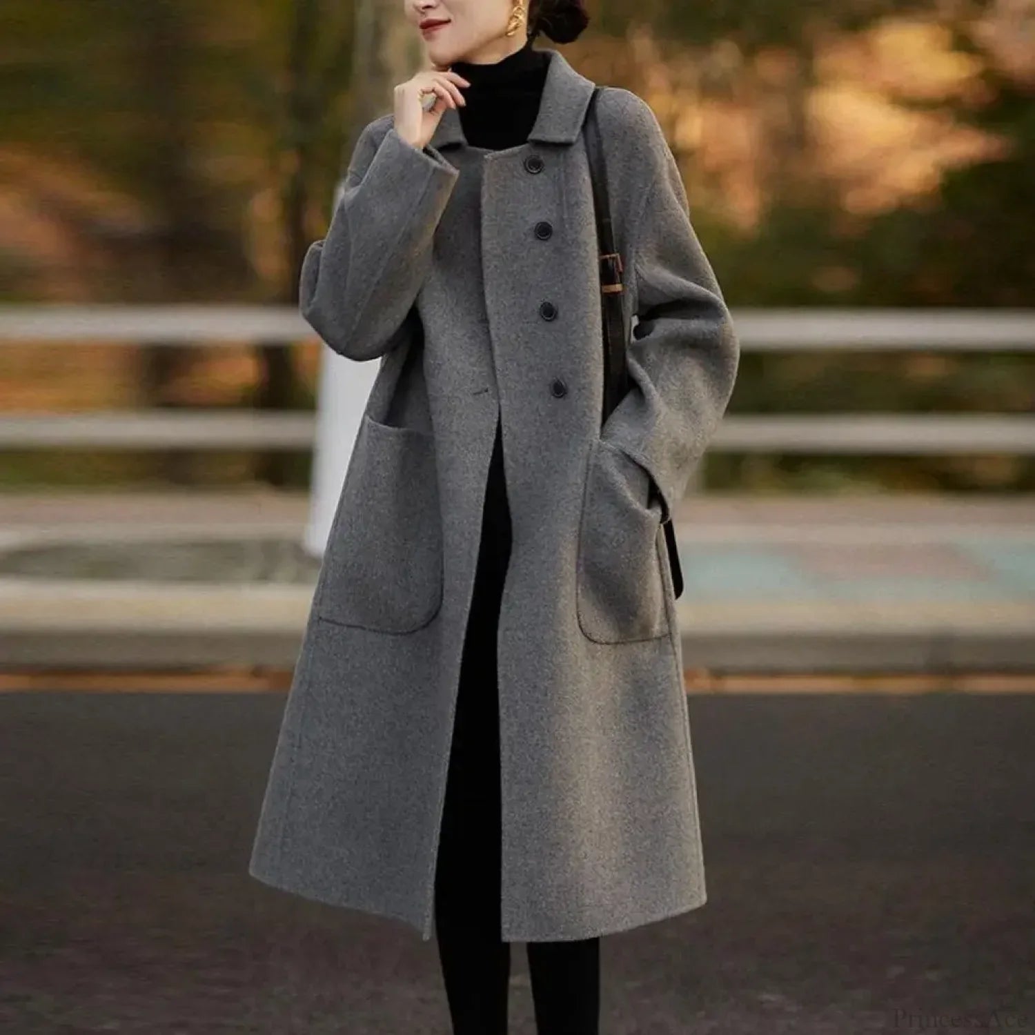 The Elegant Black O-Neck Puff Sleeve Overcoat for a Chic and Stylish Look