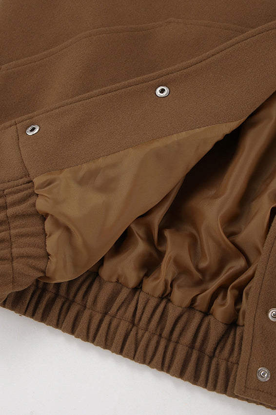 Thick brown wool coat with elastic hem for a warm and comfortable style