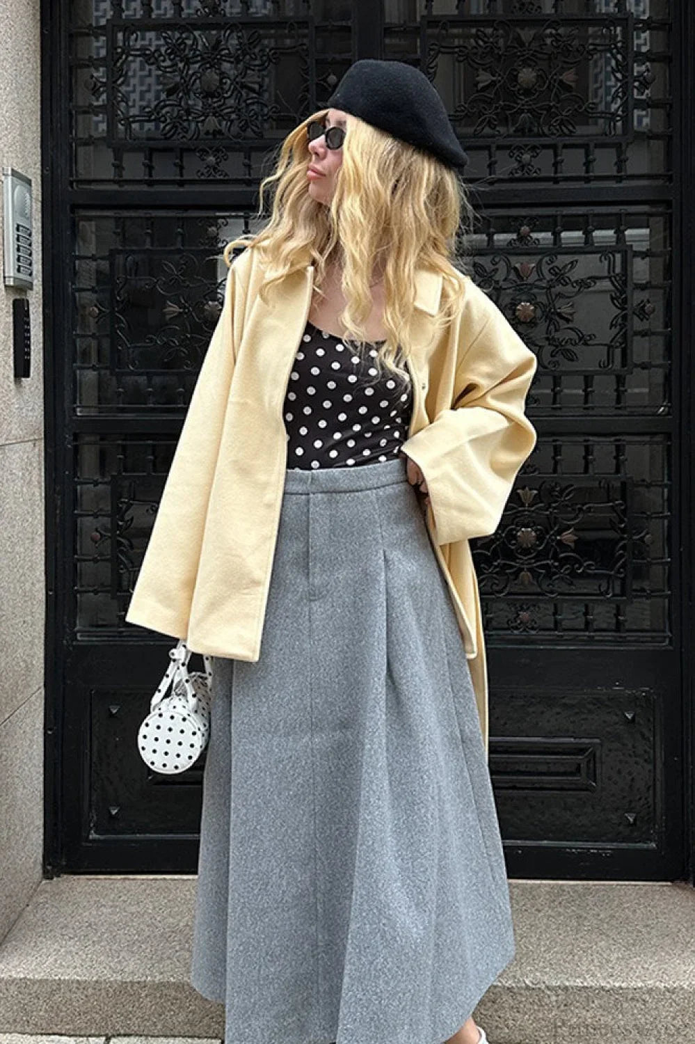 Minimalist midi-length dress in a solid color with a waist belt