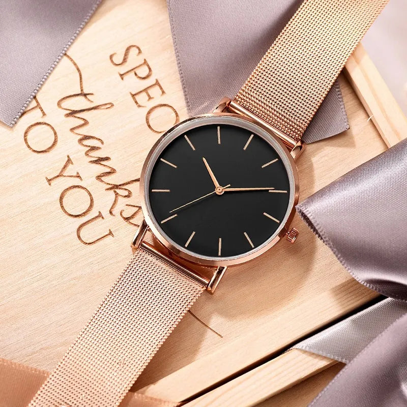 Elegant minimalist stainless steel watch with mesh bracelet