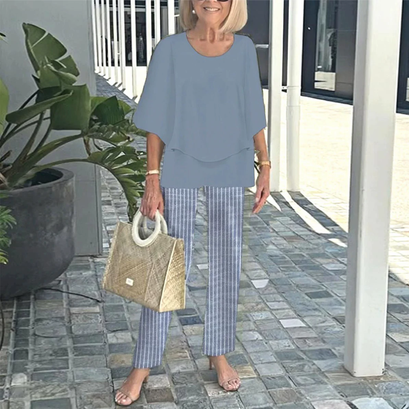 Matching set of printed pants and trendy two-piece top