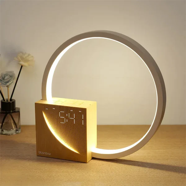 Touch-sensitive bedside alarm clock with integrated light function