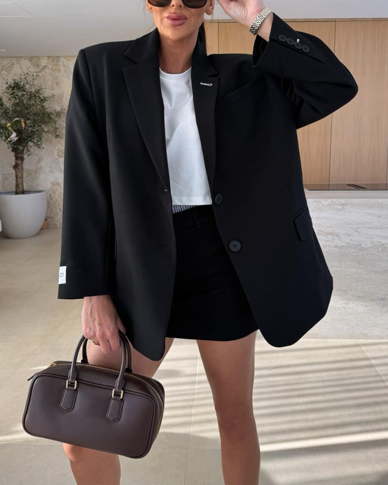 Modern elegant outfit with blazer and two-piece shorts