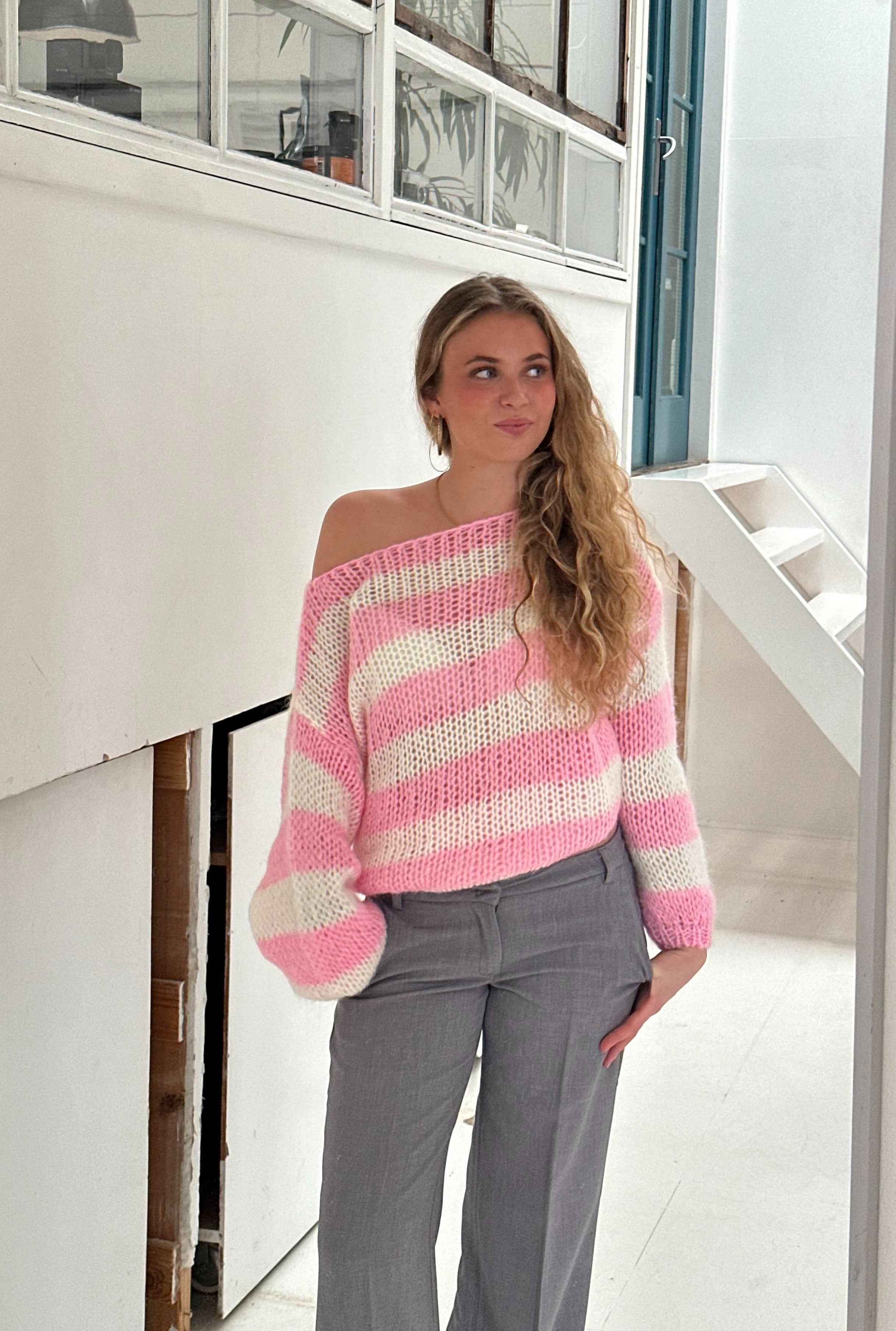 Elegant women's knitted sweater with a stylish striped pattern