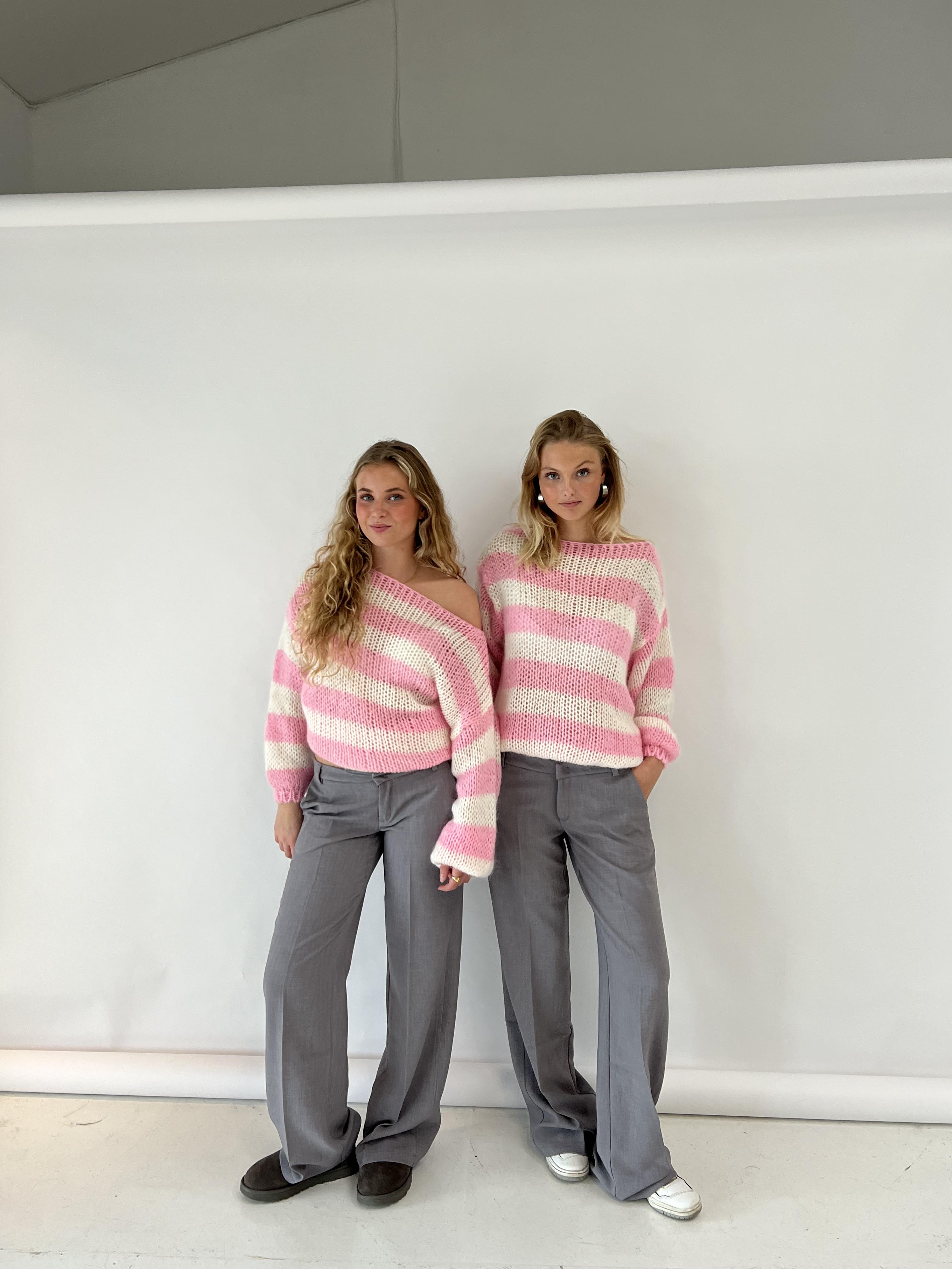 Elegant women's knitted sweater with a stylish striped pattern