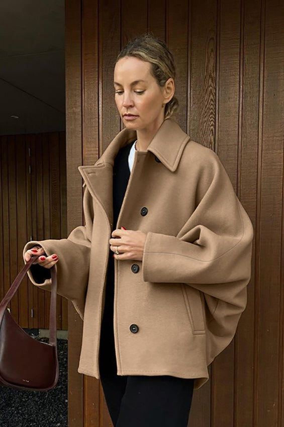 Oversized wool coat with bat wing sleeves