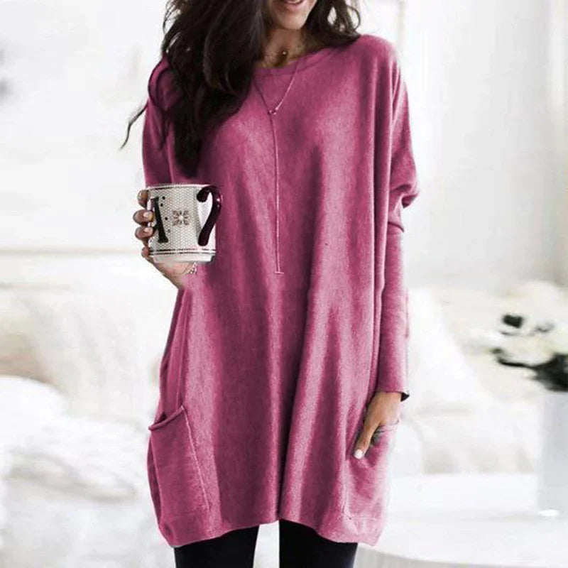 Stylish women's long sweater with spacious side pockets