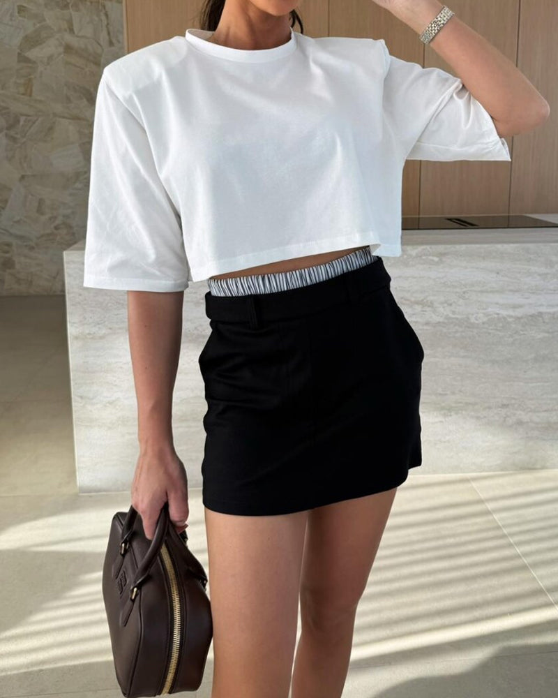 Modern elegant outfit with blazer and two-piece shorts