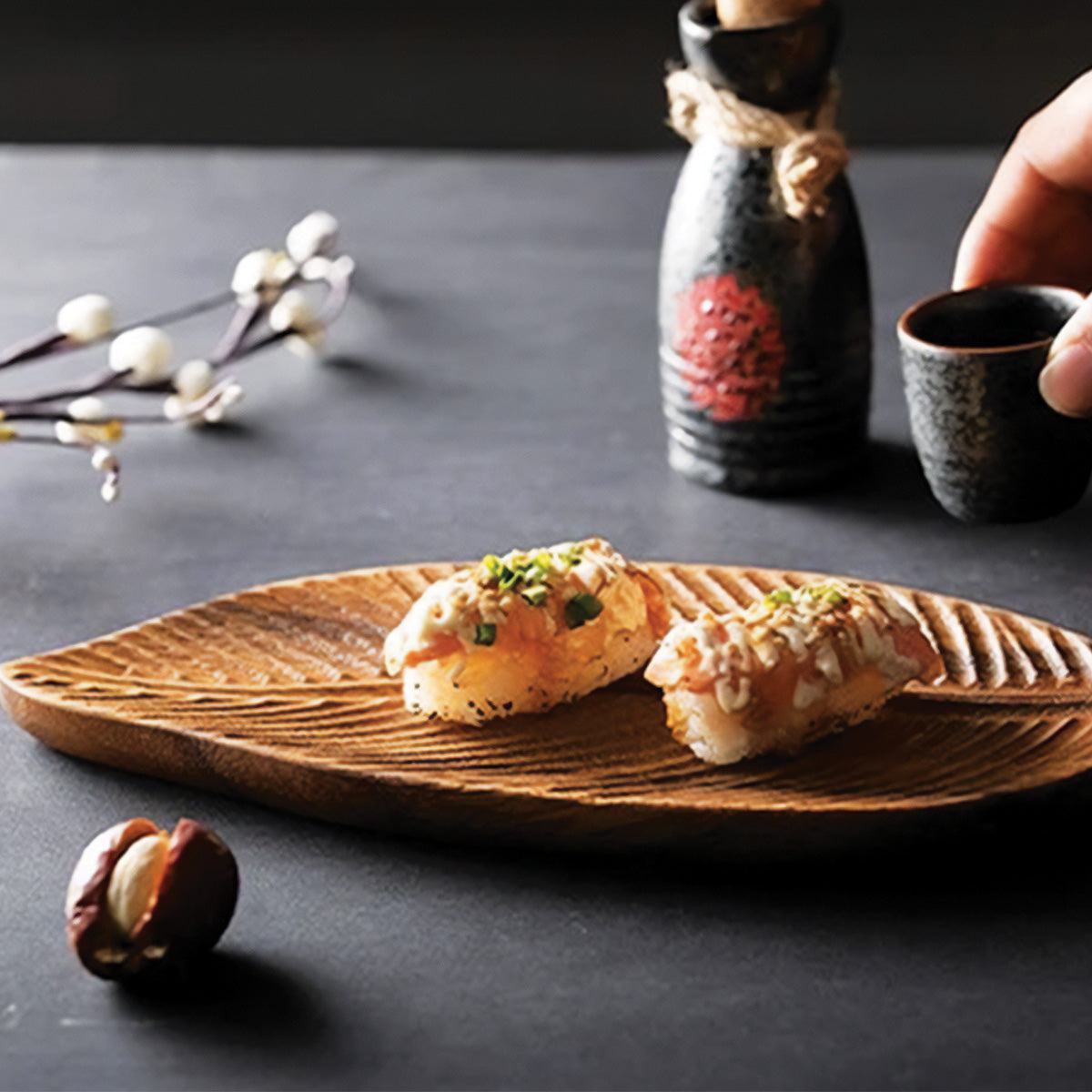 Bowl made of dark walnut wood with leaves