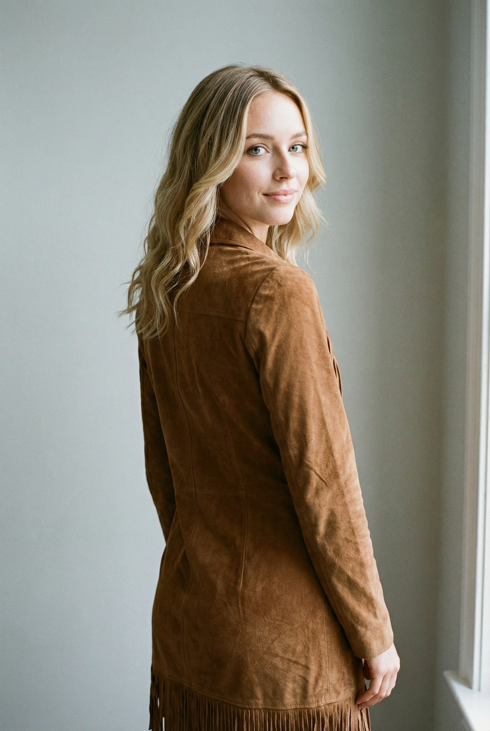 Suede midi dress with long sleeves and irregular fringes