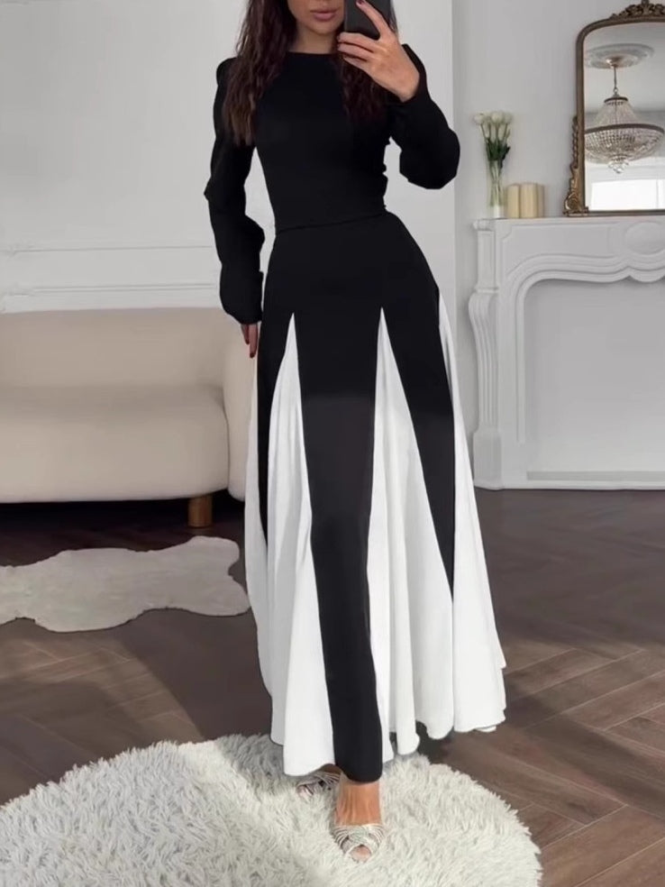Elegant long-sleeve dress with a round neck and colorblock design in black and white