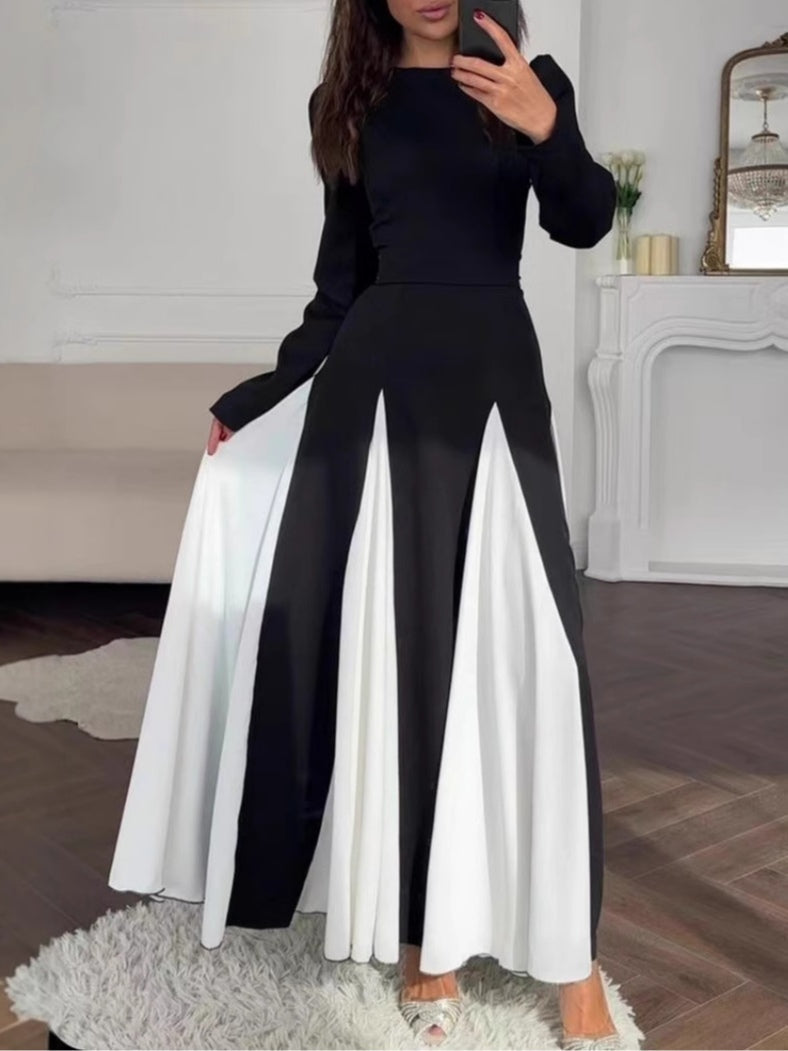 Elegant long-sleeve dress with a round neck and colorblock design in black and white