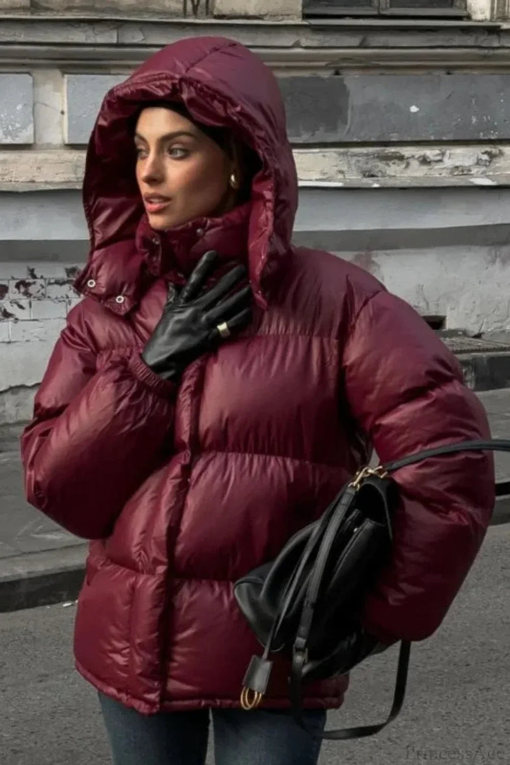 Fashionable burgundy quilted coat with a stand-up collar, single-breasted closure, and zipper
