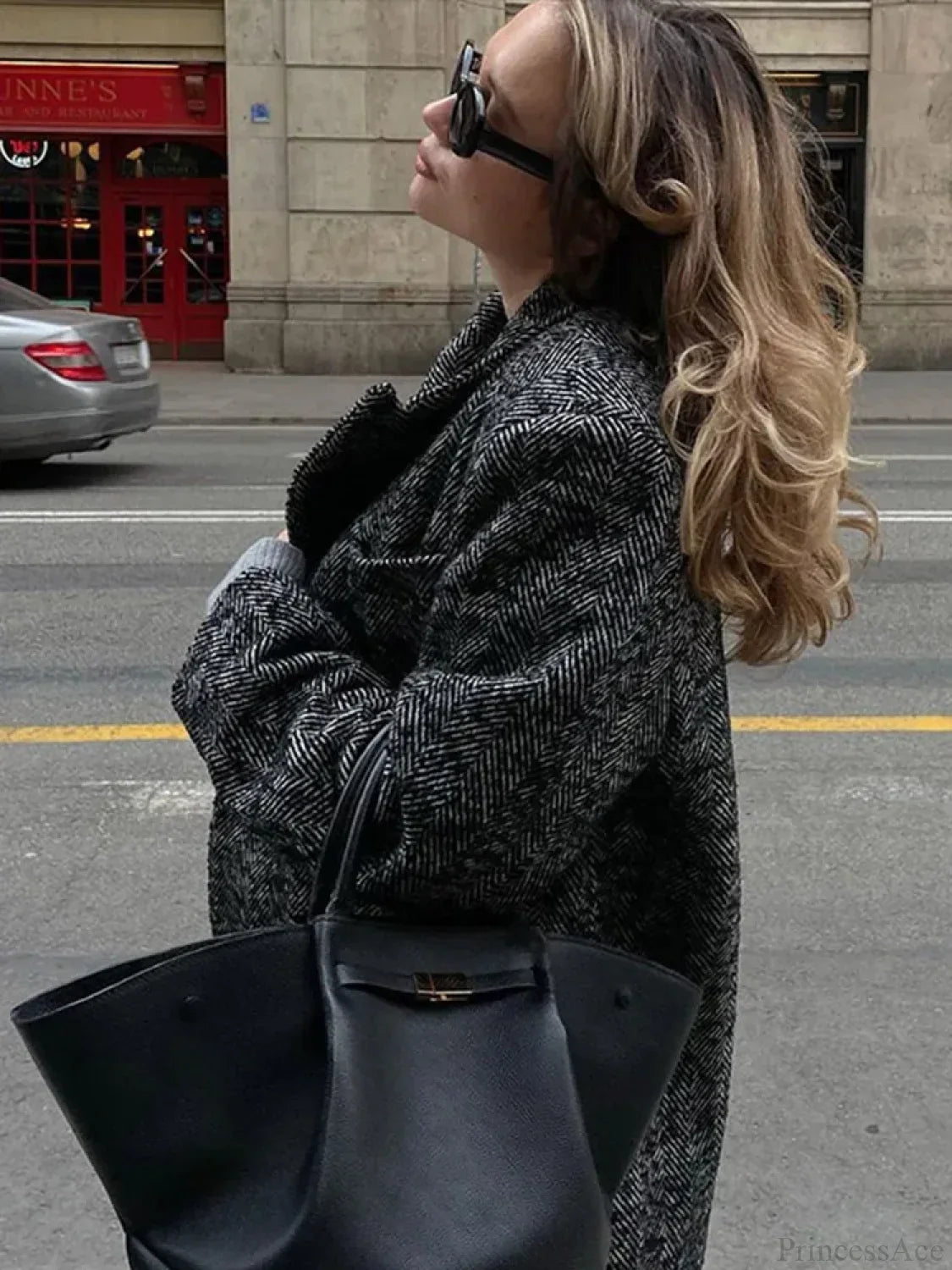 Oversized coat with laces and stylish patchwork