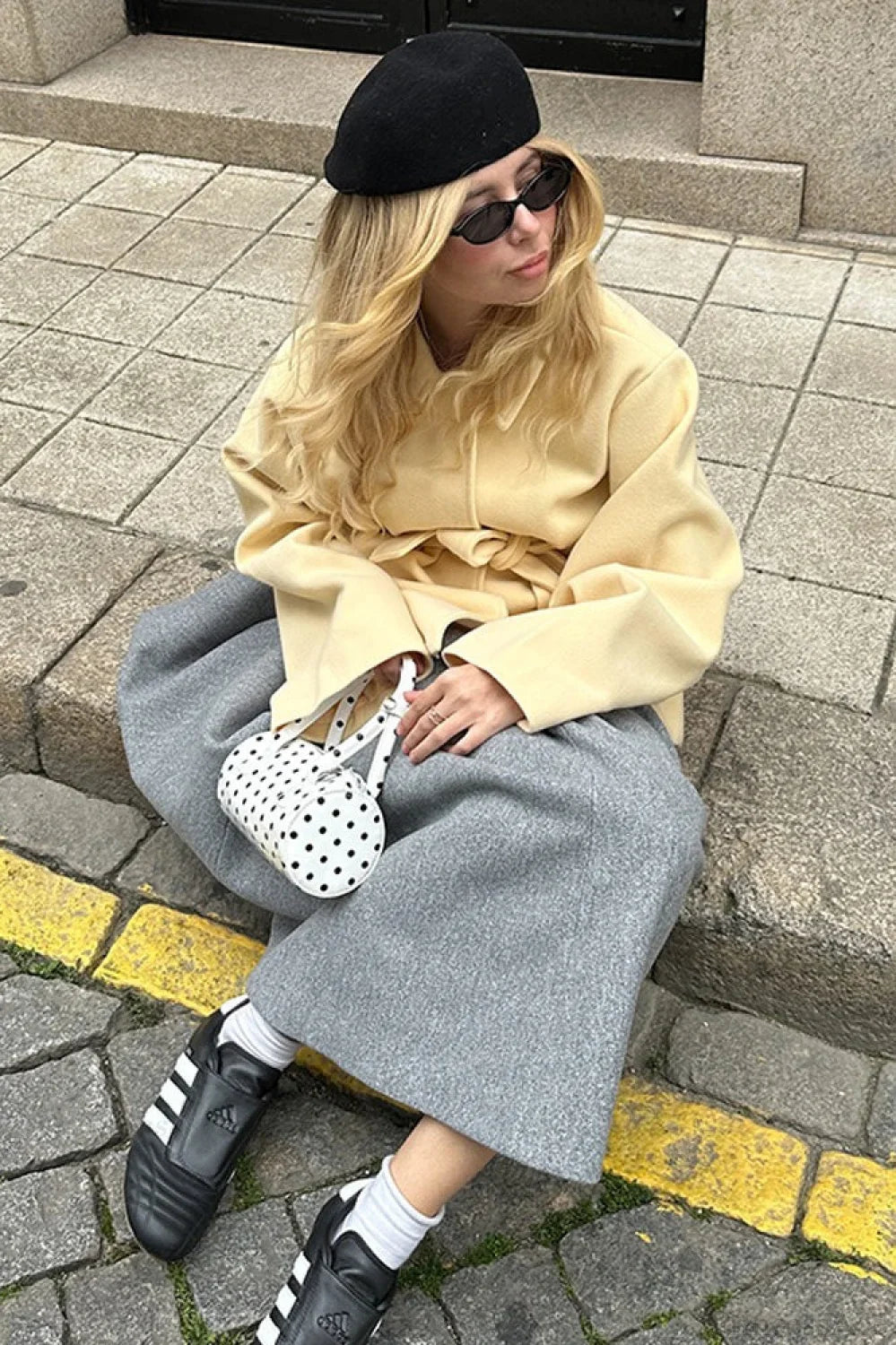 Minimalist midi-length dress in a solid color with a waist belt